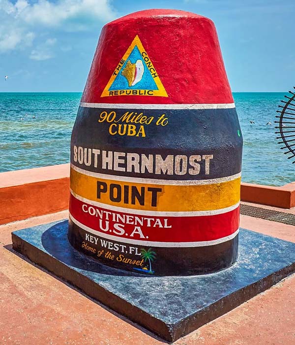 A buoy with the names of all the places on it.